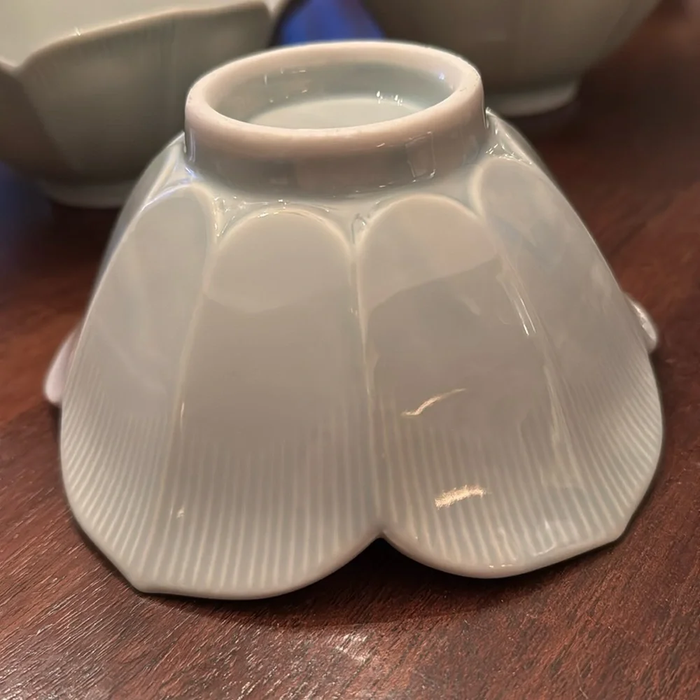 Set of four celadon lotus bowls